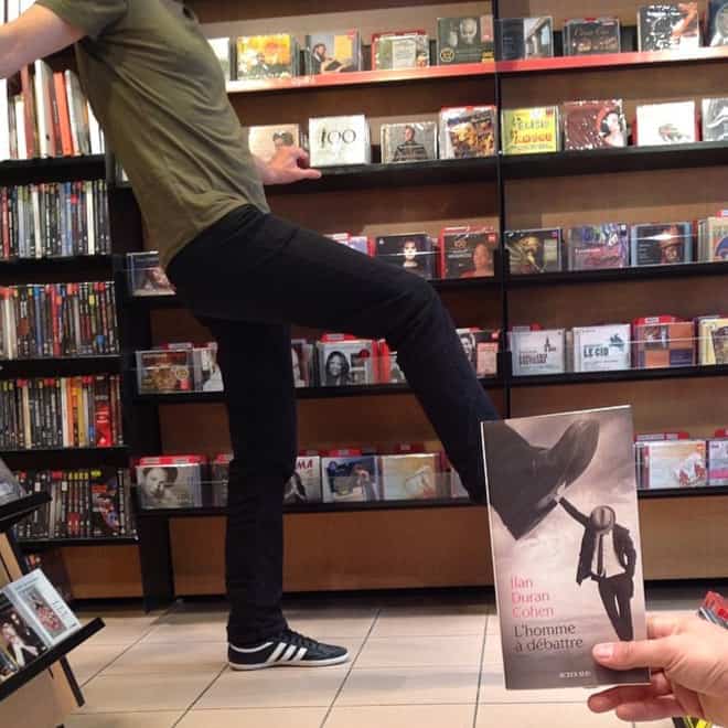 French Bookstore Librairie Mollat Customers Strategically Posing With Perfectly Matching Book Covers
