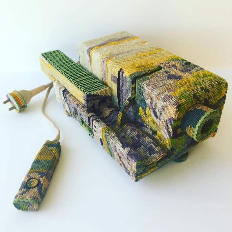 Dressed up vintage household things in cross stich embroiderys return to life as beautiful art objects